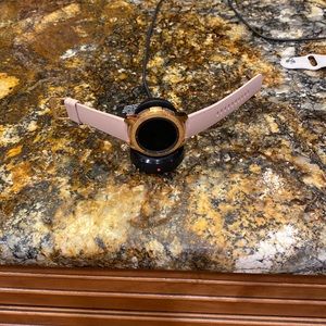 Samsung Galaxy watch with charger and instructions. Model number SM-R810